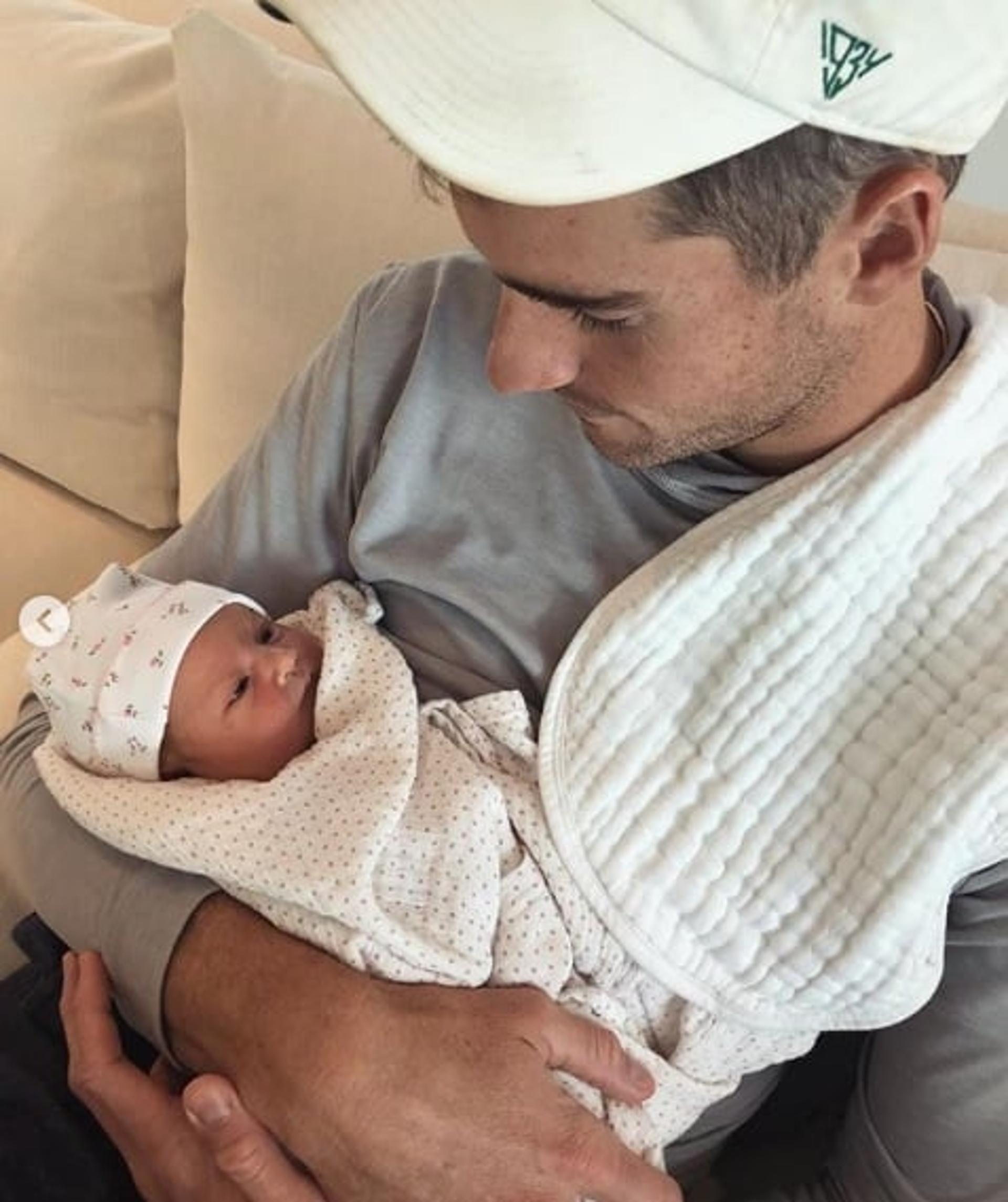 John Isner e a filha Hunter Grace