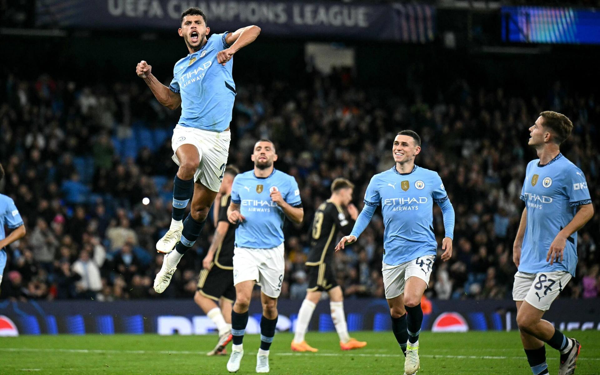 Jogadores-do-Manchester-City-comemorando-o-gol&#8211;scaled-aspect-ratio-512-320