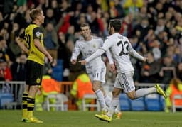 15h - LIGA DOS CAMPEÕES: O Real Madrid visita o Borussia Dortmund, adversário que nunca ganhou na Alemanha. Siga o tempo real do LANCE! O EI Maxx transmite<br>