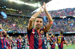 A festa para Xavi após o empate entre La Coruña e Barcelona (Foto: Lluis Gene/ AFP)