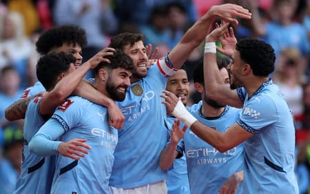 Jogadores-do-Manchester-City-comemorando-o-gol-de-Gvardiol-scaled-aspect-ratio-512-320