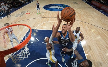 MINNEAPOLIS, MN - MAY 14: Rudy Gobert #27 of the Minnesota Timberwolves drives to the basket during the game against the Golden State Warriors during Round 2 Game 5 of the 2025 NBA Playoffs on May 14, 2025 at Target Center in Minneapolis, Minnesota. NOTE TO USER: User expressly acknowledges and agrees that, by downloading and or using this Photograph, user is consenting to the terms and conditions of the Getty Images License Agreement. Mandatory Copyright Notice: Copyright 2025 NBAE Noah Graham/NBAE via Getty Images/AFP (Photo by Noah Graham / NBAE / Getty Images / Getty Images via AFP)