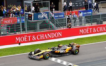 McLaren's Australian driver Oscar Piastri crosses the finish line to win the Formula One Belgian Grand Prix at the Spa-Francorchamps circuit in Spa, on July 27, 2025. (Photo by SIMON WOHLFAHRT / AFP)