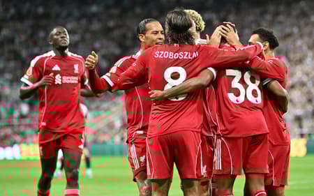 Liverpool's Dutch midfielder #38 Ryan Gravenberch (2R) celebrates with teammates after scoring the opening goal of the English Premier League football match between Newcastle United and Liverpool at St James' Park in Newcastle-upon-Tyne, north east England on August 25, 2025. (Photo by ANDY BUCHANAN / AFP) / RESTRICTED TO EDITORIAL USE. NO USE WITH UNAUTHORIZED AUDIO, VIDEO, DATA, FIXTURE LISTS, CLUB/LEAGUE LOGOS OR 'LIVE' SERVICES. ONLINE IN-MATCH USE LIMITED TO 120 IMAGES. AN ADDITIONAL 40 IMAGES MAY BE USED IN EXTRA TIME. NO VIDEO EMULATION. SOCIAL MEDIA IN-MATCH USE LIMITED TO 120 IMAGES. AN ADDITIONAL 40 IMAGES MAY BE USED IN EXTRA TIME. NO USE IN BETTING PUBLICATIONS, GAMES OR SINGLE CLUB/LEAGUE/PLAYER PUBLICATIONS. /