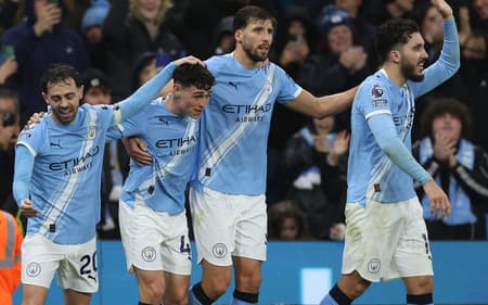 Jogadores do Manchester City comemrando o gol marcado pela Premier League (Foto: Darren Staples/AFP)