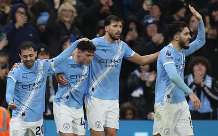Jogadores do Manchester City comemrando o gol marcado pela Premier League (Foto: Darren Staples/AFP)