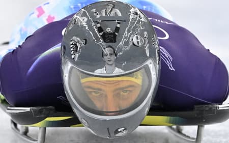 O ucraniano Vladyslav Heraskevych participa do treino masculino de skeleton no Cortina Sliding Centre durante os Jogos Olímpicos de Inverno Milano Cortina 2026, em 11 de fevereiro de 2026. (Foto: Tiziana Fabi/AFP)