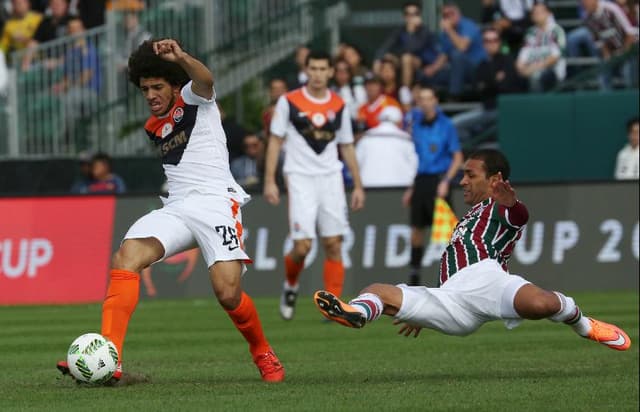 Taison do Shakhtar Doentsk contra o Fluminense (Foto: Gregg Newton/AFP)