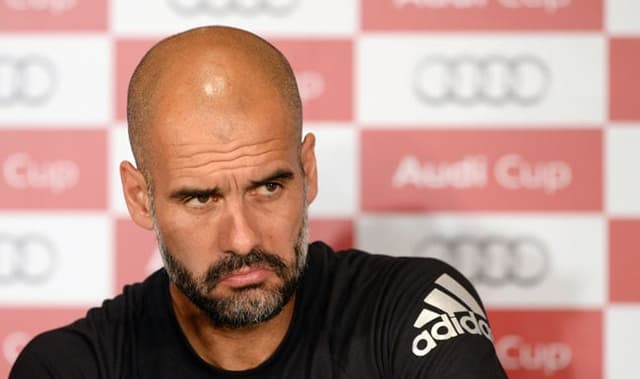 Guardiola - Bayern de Munique x Milan (Foto: Christof Stache / AFP)