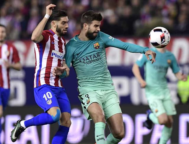 Carrasco e Piqué - Atlético de Madrid x Barcelona