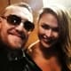 Conor McGregor posa ao lado de Ronda Rousey (FOTO: Reprodução)