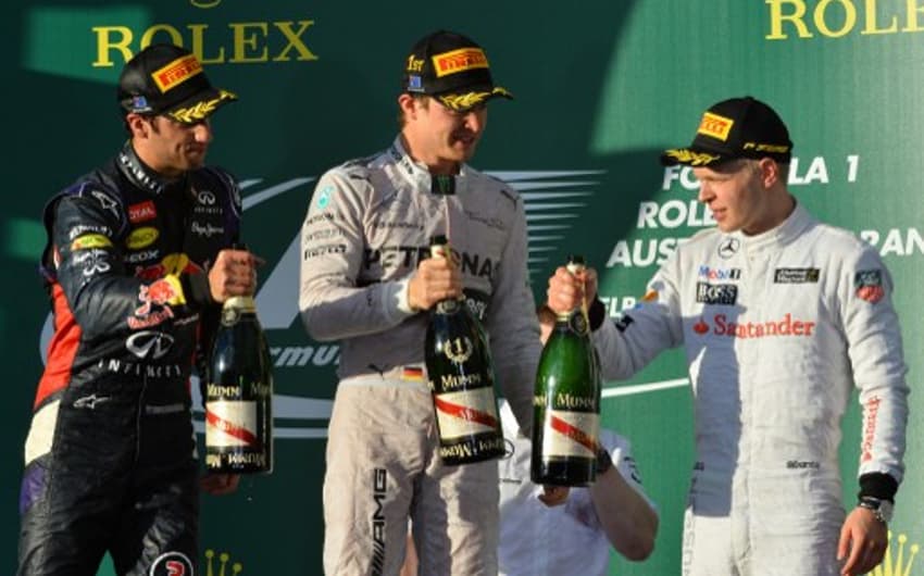 Pódio na Austrália teve o alemão Nico Rosberg, vencedor, o estreante de equipe, Daniel Ricciardo e o estreante de categoria, Kevin Magnussen  (Foto: Saeed Khan/AFP)
