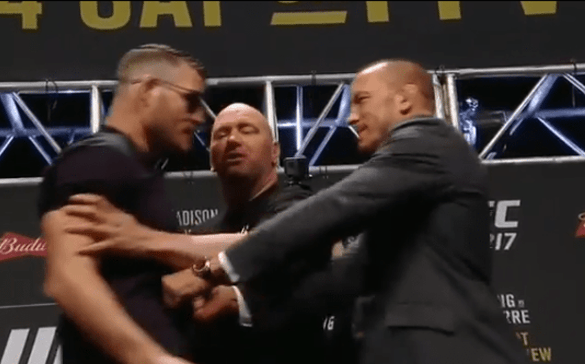 Georges Saint-Pierre empurra Michael Bisping durante encarada promocional do UFC 217