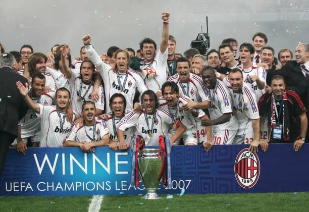 AC Milan's team poses with the trophy after winning the Champions League football final match against Liverpool, at the Olympic Stadium, in Athens, 23 May 2007. AC Milan won 2-0. AFP PHOTO / MUSTAFA OZER (Photo by MUSTAFA OZER / AFP) (Photo by MUSTAFA OZER/AFP via Getty Images) 