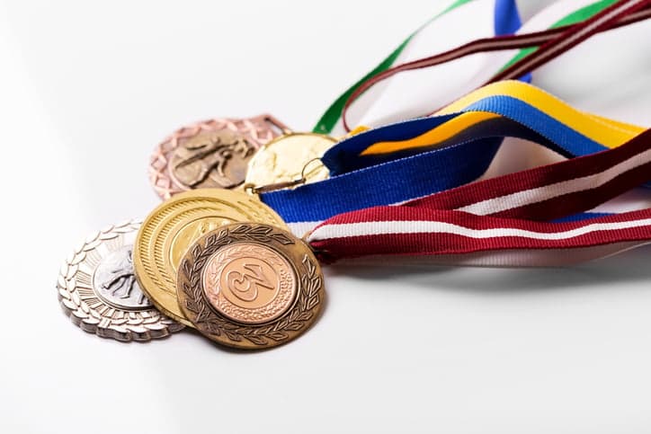 variety of sport medals on white