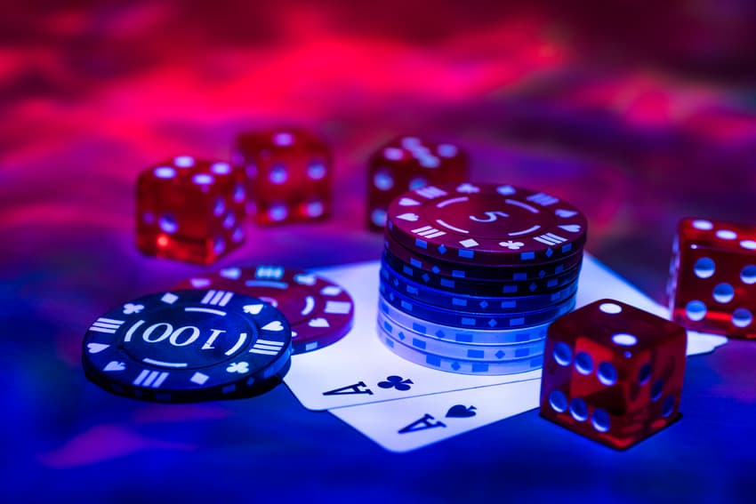 Casino abstract photo. Poker game on red background. Theme of gambling.