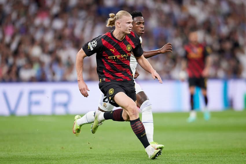 Madrid, Spain. 09th May, 2023. Erling Haaland of Manchester City FC and Vinicius Jr. of Real Madrid seen in action during the UEFA Champions League semifinal first leg football match between Real Madrid CF and Manchester City at the Santiago Bernabeu Stad