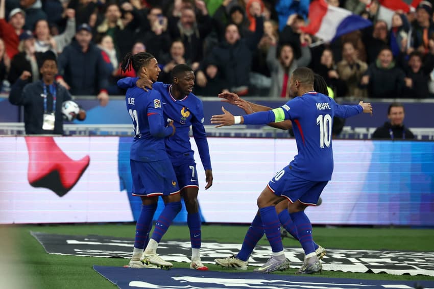 France's forward #07 Ousmane Dembele (2L) celebrates with teammates after scoring France's second goal during the UEFA Nations League quarter-final second-leg football match between France and Croatia at the Stade de France in Saint-Denis, north of Paris, on March 23, 2025. (Photo by FRANCK FIFE / AFP)