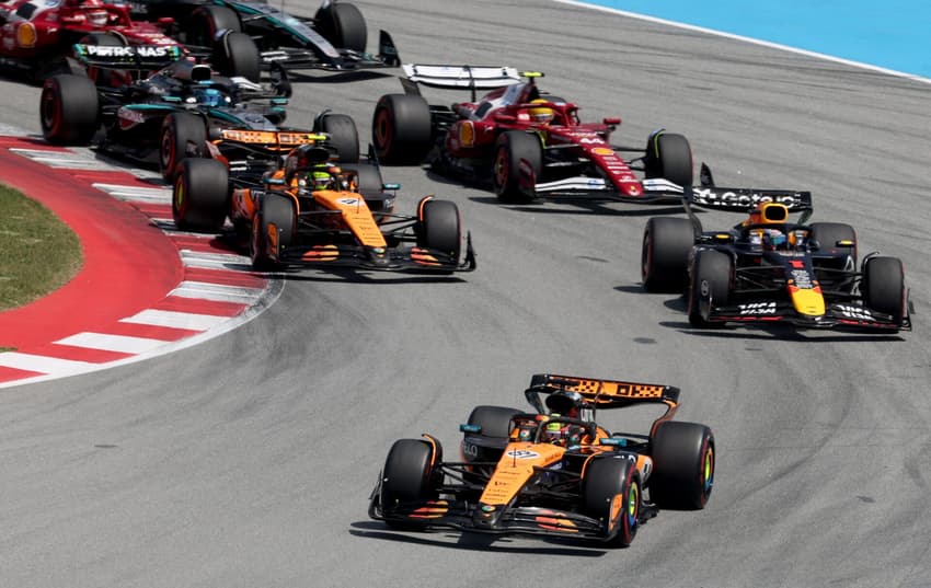 McLaren's Australian driver Oscar Piastri leads the race at the start of the Spanish Formula One Grand Prix at the Circuit de Catalunya in Montmelo, on the outskirts of Barcelona, on June 1, 2025. (Photo by Pierre-Philippe MARCOU / AFP)
