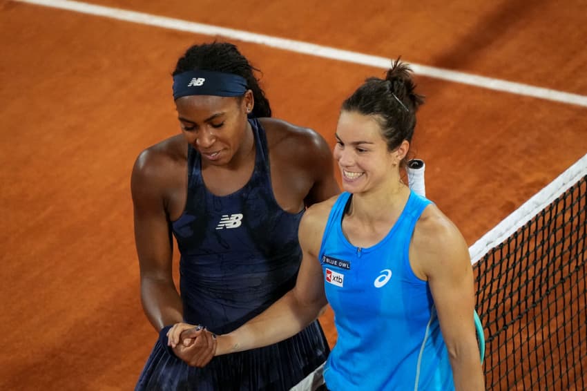 US Coco Gauff (L) shakes hands with France's Lois Boisson after winning their women's singles semi-final match on day 12 of the French Open tennis tournament on Court Philippe-Chatrier at the Roland-Garros Complex in Paris on June 5, 2025. (Photo by Dimitar DILKOFF / AFP)