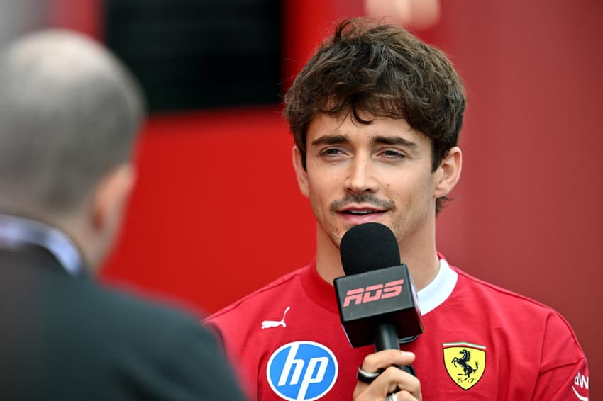 MONTREAL, QUEBEC - JUNE 12: Charles Leclerc of Monaco and Scuderia Ferrari is interviewed in the Paddock during previews ahead of the F1 Grand Prix of Canada at Circuit Gilles-Villeneuve on June 12, 2025 in Montreal, Quebec. Minas Panagiotakis/Getty Images/AFP (Photo by Minas Panagiotakis / GETTY IMAGES NORTH AMERICA / Getty Images via AFP)