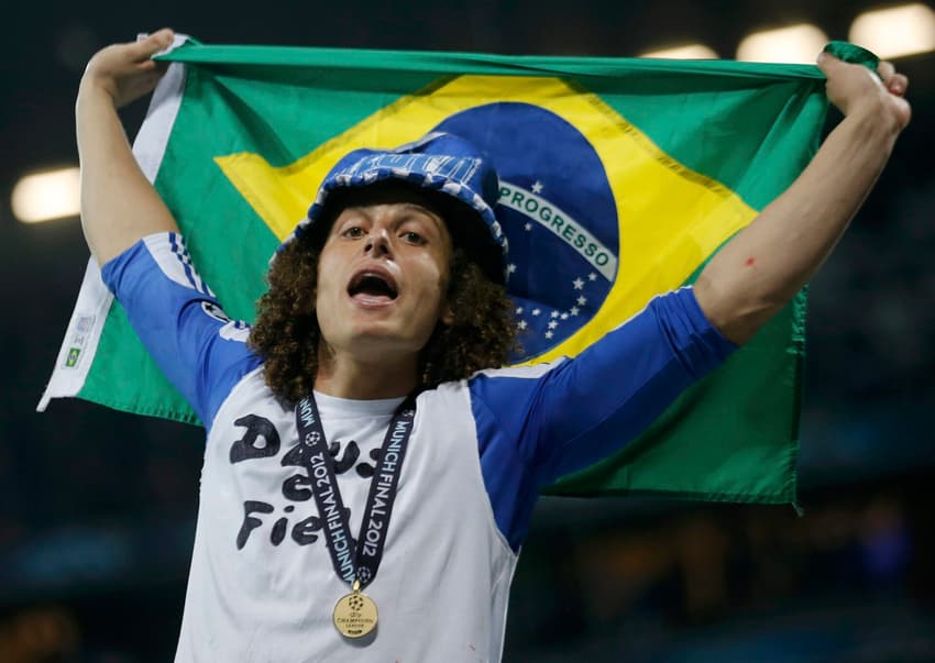 Chelsea's Luiz celebrates after winning the UEFA Champions League trophy after their final soccer match against Bayern Munic at the Allianz Arena in Munich
