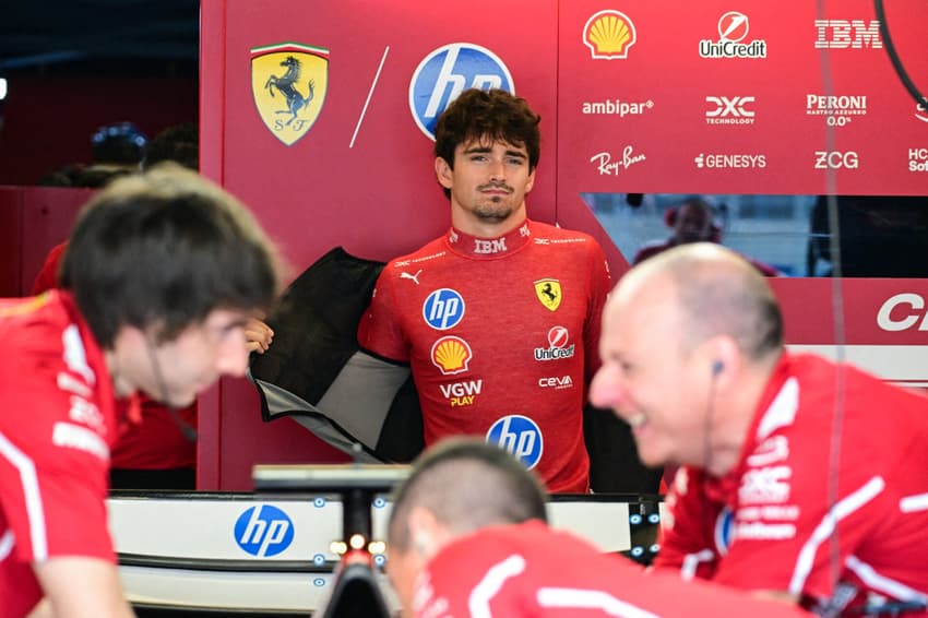 Ferrari's Monegasque driver Charles Leclerc gets ready in the garage for the practice session for the United States Formula One Grand Prix at the Circuit of the Americas in Austin, Texas, on October 17, 2025. (Photo by Jim WATSON / AFP)