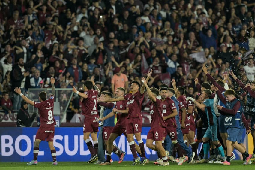 Lanus' players celebrate after winning the Copa Sudamericana semifinal second leg football match between Argentina's Lanus and Chile's Universidad de Chile at the Ciudad de Lanus stadium in Lanus, Buenos Aires province, on October 30, 2025. (Photo by Juan MABROMATA / AFP)