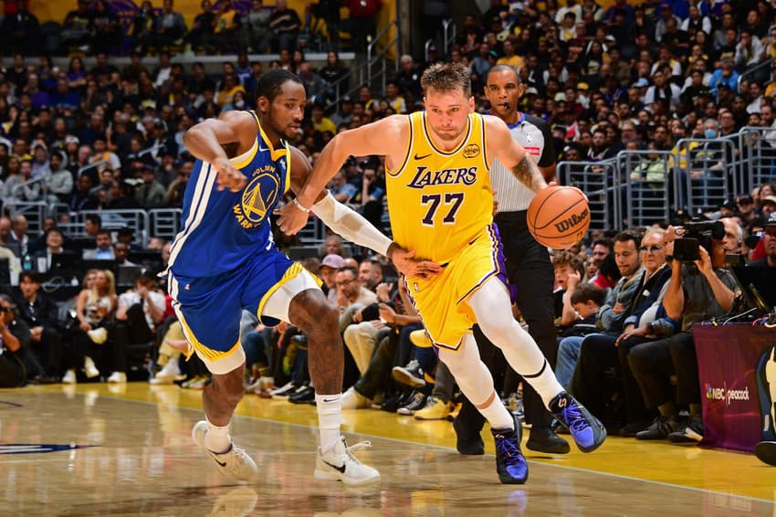 LOS ANGELES, CA - OCTOBER 21: Luka Doncic #77 of the Los Angeles Lakers drives to the basket during the game aGolden State Warriors on October 21, 2025 at Crypto.Com Arena in Los Angeles, California. NOTE TO USER: User expressly acknowledges and agrees that, by downloading and/or using this Photograph, user is consenting to the terms and conditions of the Getty Images License Agreement. Mandatory Copyright Notice: Copyright 2025 NBAE Adam Pantozzi/NBAE via Getty Images/AFP (Photo by Adam Pantozzi / NBAE / Getty Images / Getty Images via AFP)