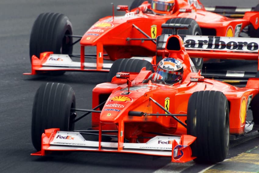German Michel Schumacher drives his Ferrari chased by teamate Rubens Barichello of Brazil, during the untimed practice session Friday, March 24, 2000 in Sao Paulo for Sunday's Brazilian Formula One Grand Prix. (AP Photo/Dario Lopez Mills)