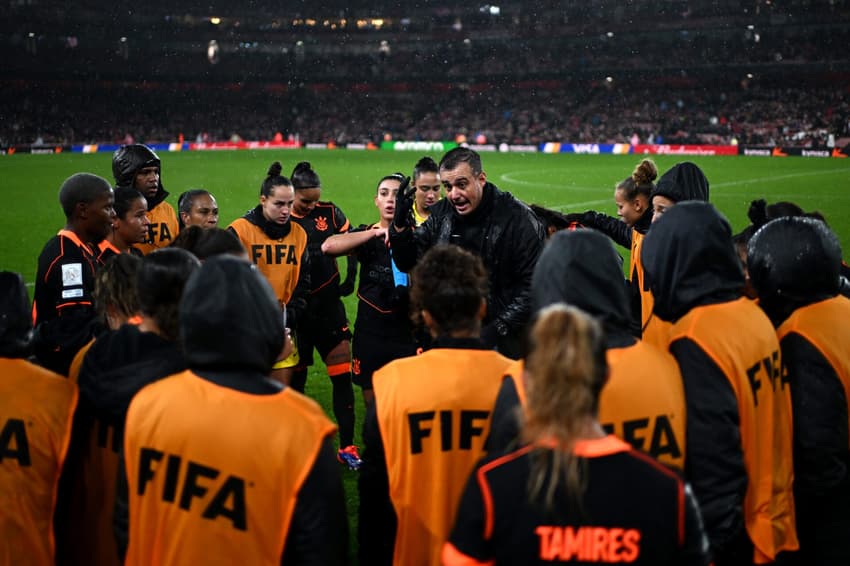 LONDON, ENGLAND - FEBRUARY 01: Lucas Piccinato, Head Coach of SC Corinthians, speaks to his team before the extra time in the FIFA Women's Champions Cup 2026 Final match between Arsenal Women FC and SC Corinthians at Arsenal Stadium on February 01, 2026 in London, England. (Photo by Harriet Lander - FIFA/FIFA via Getty Images)