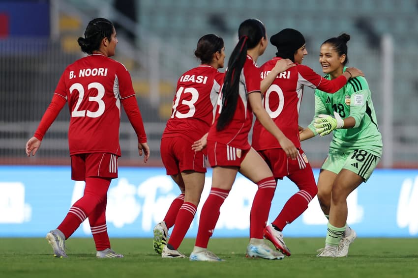 CASABLANCA, MOROCCO - NOVEMBER 01: Fatema Haidari of Afghan Women's United celebrates scoring her team's seventh goal with teammates Elaha Safdari and Kereshma Abasi of Afghan Women's United during the FIFA Unites: Women's Series 2025 match between Libya and Afghan Women United on November 01, 2025 in Casablanca, Morocco. (Photo by Francois Nel - FIFA/FIFA via Getty Images)