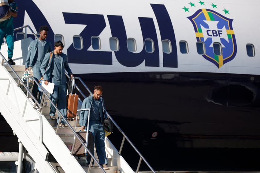 (L/R) Brazil's forward Vinicius Junior, midfielder Lucas Paqueta, and forward Neymar step off the plane as team Brazil arrives at Newark Liberty International Airport (EWR) in Newark, New Jersey on June 2, 2026 ahead of the FIFA World Cup. (Photo by Leonardo MUNOZ / AFP)