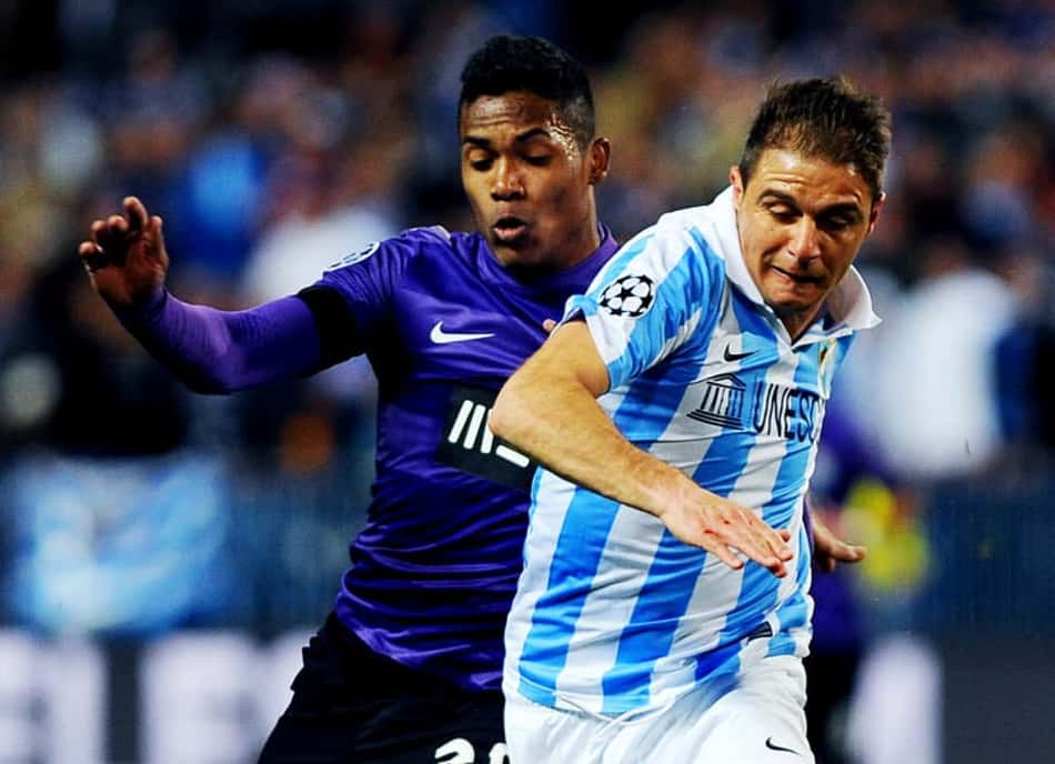 Malaga x Porto - Liga dos Campeões - Alex Sandro e Joaquin Sanchez (Foto: Jorge Guerrero/AFP)