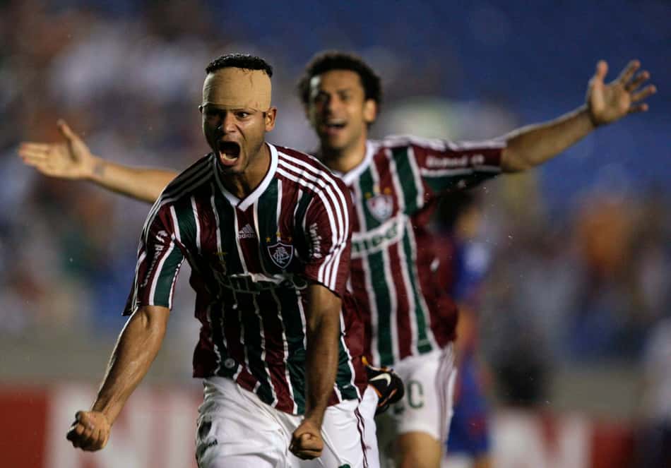 Gum of Brazil's Fluminense celebrates with teammate Fred after scoring against Paraguay's Cerro Porteno during their Copa Sudamericana semi-final soccer match in Rio de Janeiro