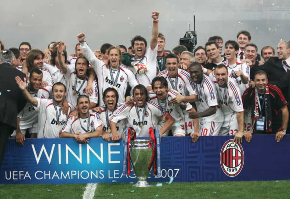 AC Milan's team poses with the trophy after winning the Champions League football final match against Liverpool, at the Olympic Stadium, in Athens, 23 May 2007. AC Milan won 2-0. AFP PHOTO / MUSTAFA OZER (Photo by MUSTAFA OZER / AFP) (Photo by MUSTAFA OZER/AFP via Getty Images)