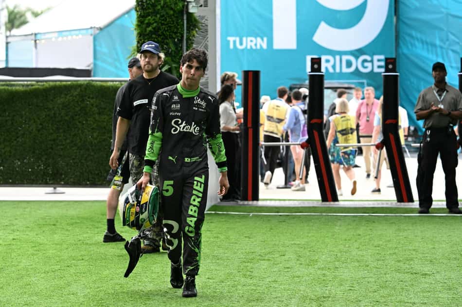 Kick Sauber's Brazilian driver Gabriel Bortoleto walks back to his garage during the 2025 Miami Formula One Grand Prix at Miami International Autodrome in Miami Gardens, Florida, on May 4, 2025. (Photo by Chandan Khanna / AFP)