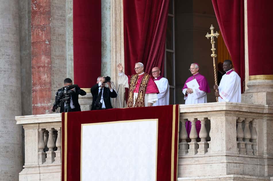 This photo taken and handout on May 7, 2025 by The Vatican Media shows Newly elected Pope Leo XIV, Robert Prevost addressing the crowd from the main central loggia balcony of the St Peter's Basilica for the first time, after the cardinals ended the conclave, in The Vatican. (Photo by Handout / VATICAN MEDIA / AFP) / RESTRICTED TO EDITORIAL USE - MANDATORY CREDIT "AFP PHOTO / VATICAN MEDIA" - NO MARKETING - NO ADVERTISING CAMPAIGNS - DISTRIBUTED AS A SERVICE TO CLIENTS