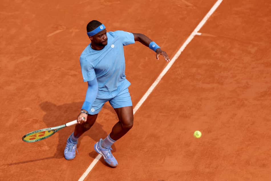 US Frances Tiafoe plays a forehand return to Italy's Lorenzo Musetti during their quarter-final men's singles match on day 10 of the French Open tennis tournament on Court Philippe-Chatrier at the Roland-Garros Complex in Paris on June 3, 2025. (Photo by ALAIN JOCARD / AFP)