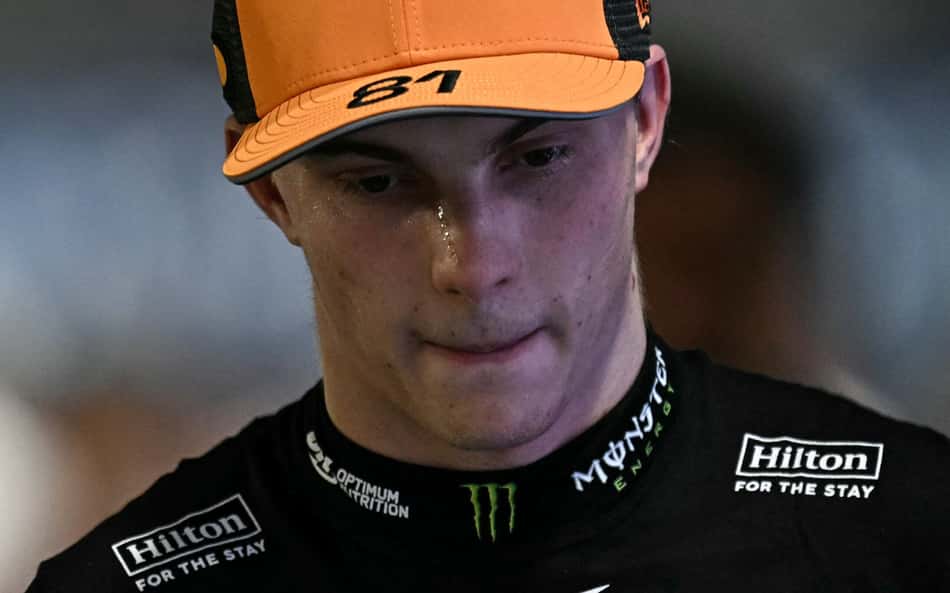Third-placed McLaren's Australian driver Oscar Piastri looks after the qualifying session for the Formula One Singapore Grand Prix night race at the Marina Bay Street Circuit in Singapore on October 4, 2025. (Photo by Lillian SUWANRUMPHA / AFP)