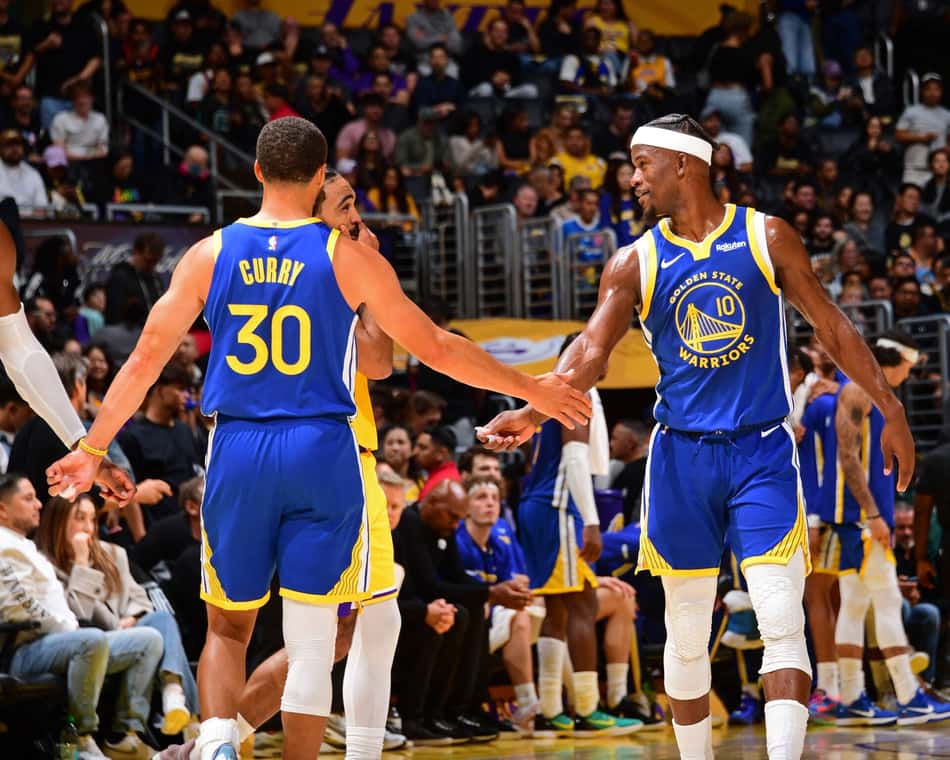 LOS ANGELES, CA - OCTOBER 21: Stephen Curry #30 high fives Jimmy Butler III #10 of the Golden State Warriors during the game against the Los Angeles Lakers on October 21, 2025 at Crypto.Com Arena in Los Angeles, California. NOTE TO USER: User expressly acknowledges and agrees that, by downloading and/or using this Photograph, user is consenting to the terms and conditions of the Getty Images License Agreement. Mandatory Copyright Notice: Copyright 2025 NBAE Adam Pantozzi/NBAE via Getty Images/AFP (Photo by Adam Pantozzi / NBAE / Getty Images / Getty Images via AFP)