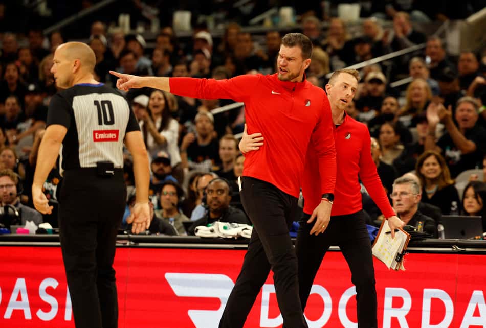 SAN ANTONIO, TX -APRIL 21: Tiago Splitter interim head coach of the Portland Trailblazers in is restrained after getting a technical during game against the San Antonio Spurs in the second half of Game Two of the Western Conference First Round NBA Playoffs at Frost Bank Center on April 21, 2026 in San Antonio, Texas. NOTE TO USER: User expressly acknowledges and agrees that, by downloading and or using this photograph, User is consenting to terms and conditions of the Getty Images License Agreement. Ronald Cortes/Getty Images/AFP (Photo by Ronald Cortes / GETTY IMAGES NORTH AMERICA / Getty Images via AFP)