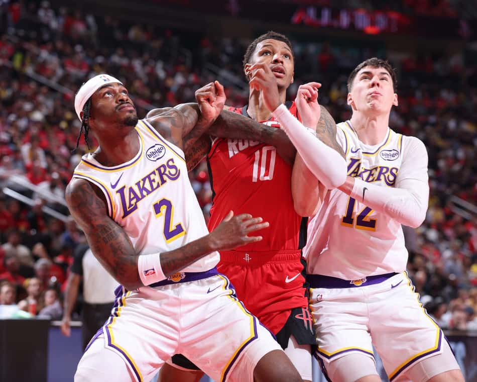HOUSTON, TX - APRIL 26: Jarred Vanderbilt #2 and Jake Laravia #12 of the Los Angeles Lakers box out Jabari Smith Jr. #10 of the Houston Rockets during Round One Game Four on April 26, 2026 at the Toyota Center in Houston, Texas. NOTE TO USER: User expressly acknowledges and agrees that, by downloading and or using this photograph, User is consenting to the terms and conditions of the Getty Images License Agreement. Mandatory Copyright Notice: Copyright 2026 NBAE Logan Riely/NBAE via Getty Images/AFP (Photo by Logan Riely / NBAE / Getty Images / Getty Images via AFP)