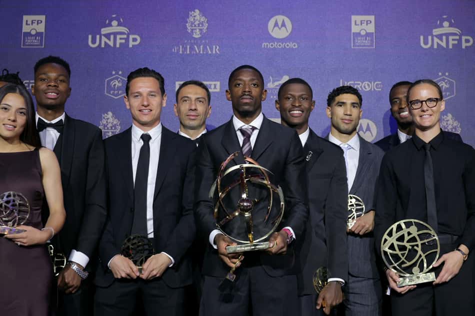Paris Saint-Germain's French forward #10 Ousmane Dembele (C) poses with the Ligue 1 best player award among other laureates at the end of the 34th UNFP's (France's professional players union) French football awards ceremony in Paris on May 11, 2026. (Photo by Thomas SAMSON / AFP)
