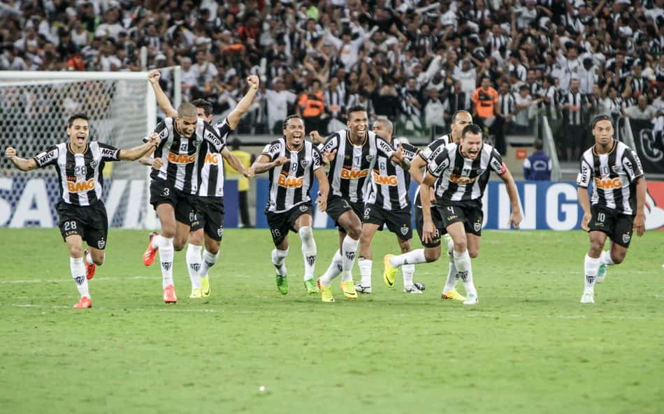 Jogadores correm para comemorar título da Libertadores (Foto: Bruno Cantini / Atlético)