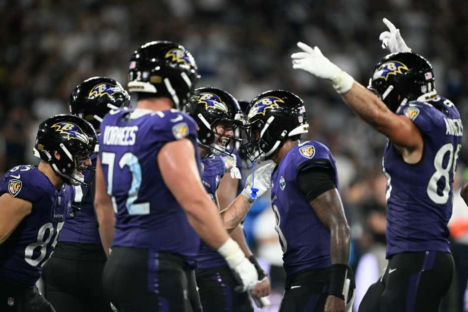 Jogadores dos Ravens comemorando no NFL Rio Game. (Photo by MAURO PIMENTEL / AFP)