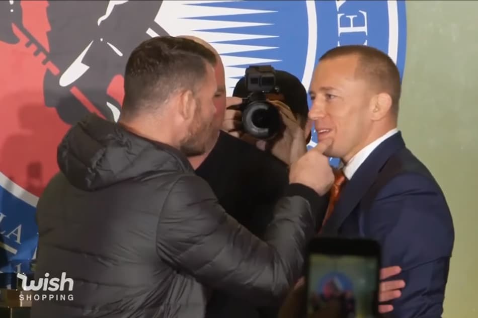 Bisping toca queixo de St-Pierre e leva novo empurrão em encarada
