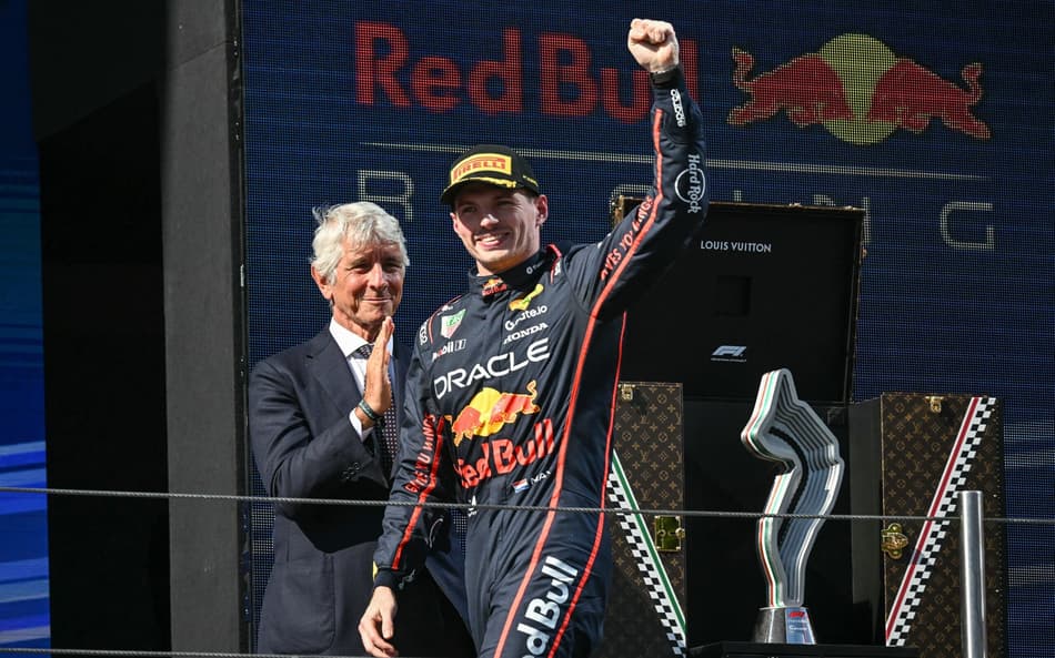 Red Bull Racing's Dutch driver Max Verstappen celebrates on the podium after winning the 2025 Emilia Romagna Formula One Grand Prix at the Imola autodrome in Imola, on May 18, 2025. (Photo by Andrej ISAKOVIC / AFP)