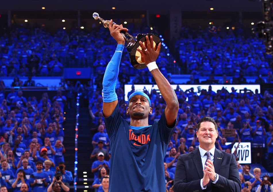 OKLAHOMA CITY, OK - MAY 22: Shai Gilgeous-Alexander #2 of the Oklahoma City Thunder receives the 2024-25 Kia NBA MVP Award before the game against the Minnesota Timberwolves during Game Two of the Western Conference Finals on May 22, 2025 at Paycom Center in Oklahoma City, Oklahoma. NOTE TO USER: User expressly acknowledges and agrees that, by downloading and or using this photograph, User is consenting to the terms and conditions of the Getty Images License Agreement. Mandatory Copyright Notice: Copyright 2025 NBAE Zach Beeker/NBAE via Getty Images/AFP (Photo by Zach Beeker / NBAE / Getty Images / Getty Images via AFP)
