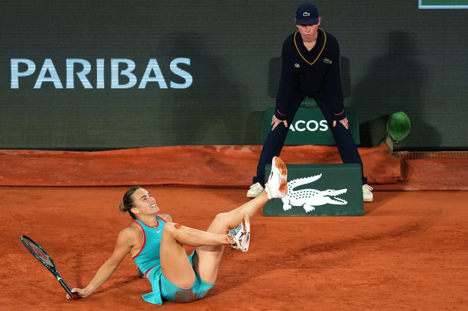Belarus' Aryna Sabalenka falls on the court during her women's singles semi-final match against Poland's Iga Swiatek on day 12 of the French Open tennis tournament on Court Philippe-Chatrier at the Roland-Garros Complex in Paris on June 5, 2025. (Photo by Dimitar DILKOFF / AFP)